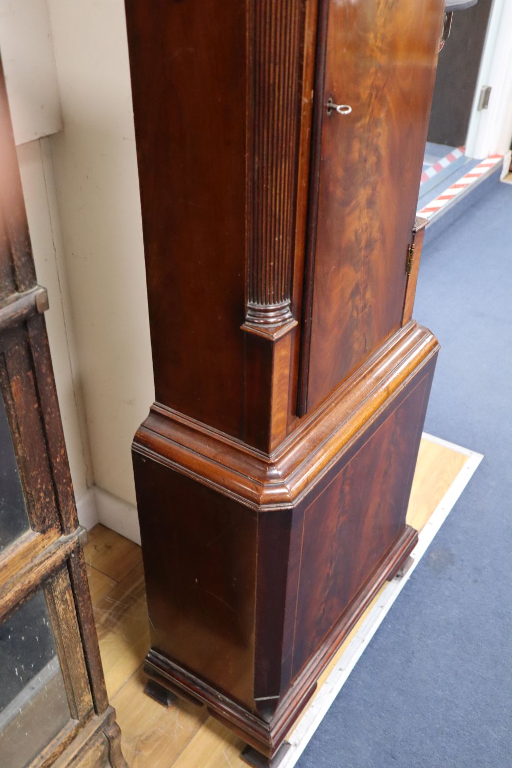 A George III mahogany longcase clock, having thirty-hour movement with 14 inch square dial signed Wm.